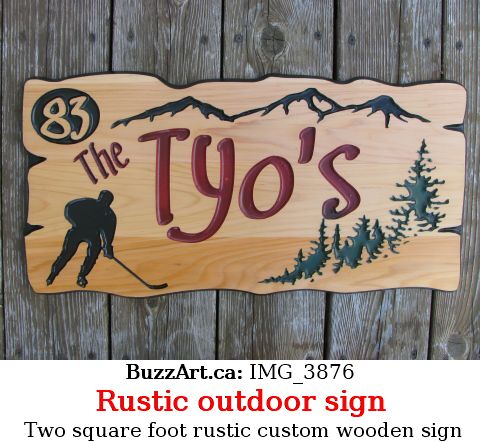 Custom wood sign with hockey player, mountains and trees